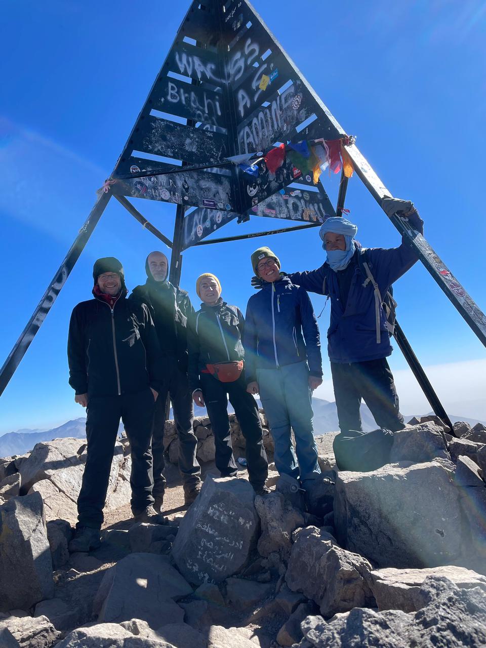 Mouloud and tourists at the summit of Mount Toubkal
